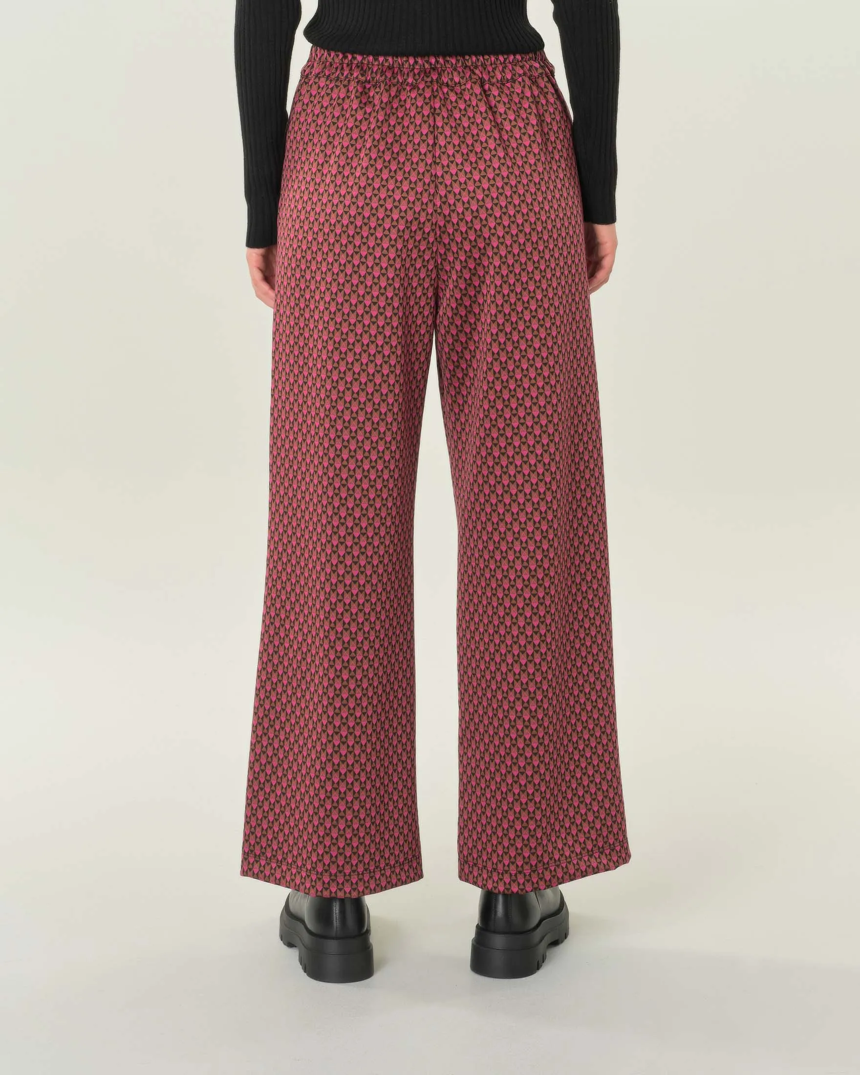 Pantalone palazzo in jersey a fantasia geometrica nera e fucsia